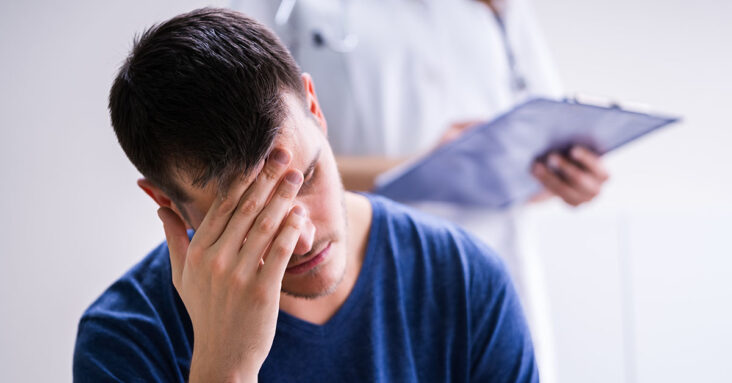 Male Patient With Headache In A Clinic